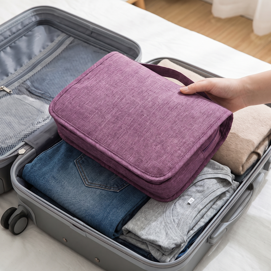 Toiletry bag folded flat, packing into a case